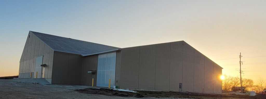 Dry fertilizer storage and blending building in Loda Illinois at sunset