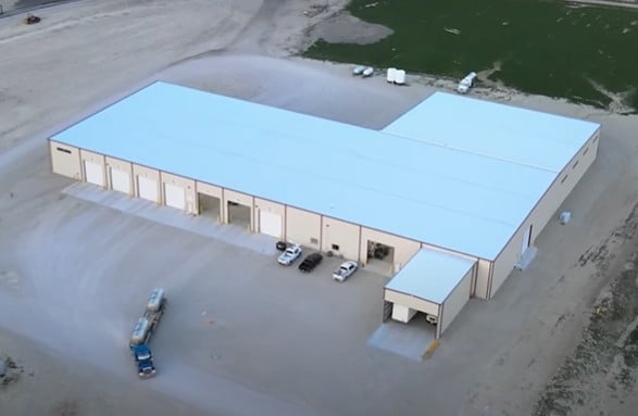 ovehead view of a metal Liquid fertilizer building built by Stueve Construction with farm trucks moving
