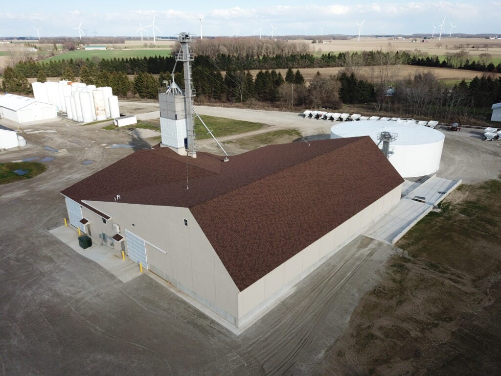Fair Grove Michigan dry fertilizer blend building with tower and UAN tank at farmers coop