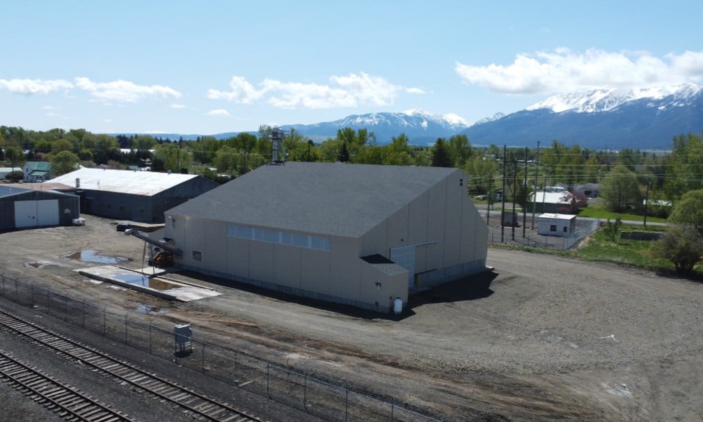 Dry fertilizer plant with mountains and farms in the back ground