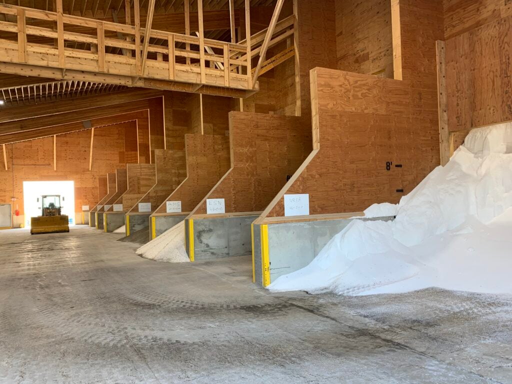 inside of dr fertilizer building with different types of bulk plant food