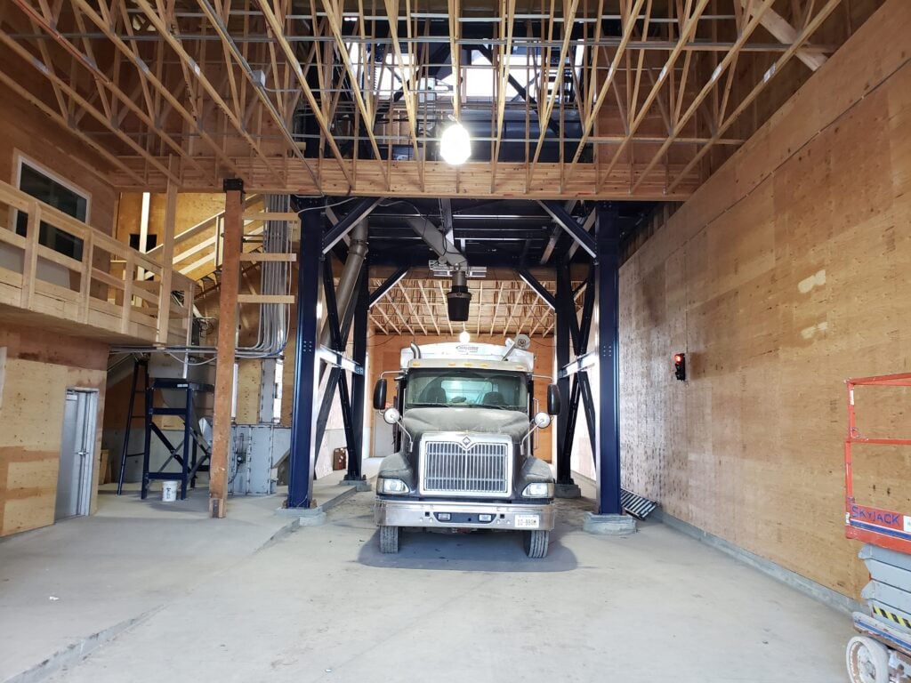 loading farm fertilizer into a truck
