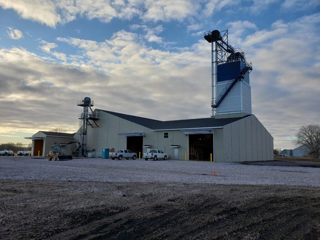 fertilizer building with blend tower and clouds