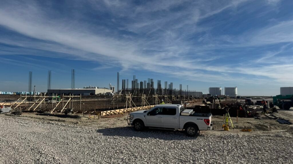 dry fertilizer building construction with truck and workers